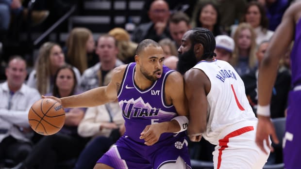 Dec 8, 2023; Salt Lake City, Utah, USA; Utah Jazz guard Talen Horton-Tucker (5) posts up against Los Angeles Clippers guard James Harden (1) during the fourth quarter at Delta Center.